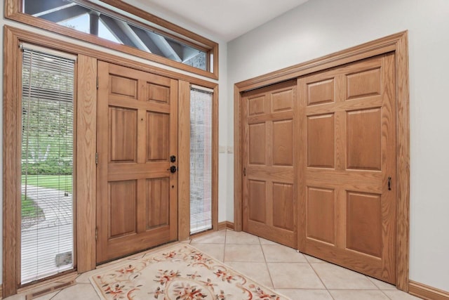 W313N4961 Chapel Ridge Rd, Hartland, WI 53029 - foyer with light tile patterned floors, plenty of natural light, and baseboards