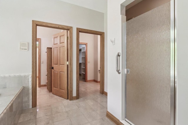 W313N4961 Chapel Ridge Rd, Hartland, WI 53029 - full bath with a shower stall, tile patterned flooring, baseboards, and a tub to relax in