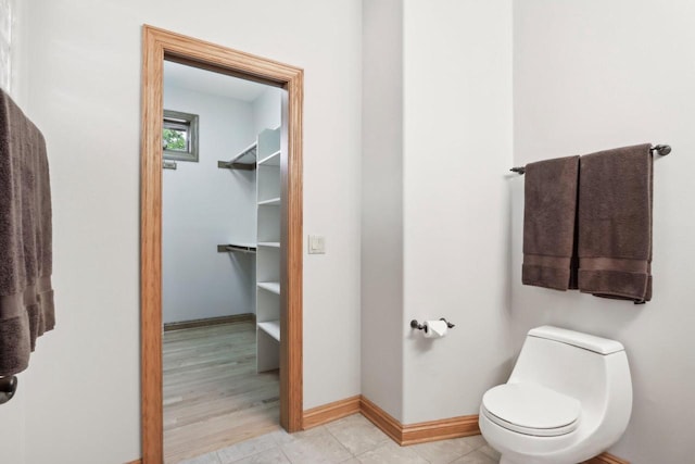 W313N4961 Chapel Ridge Rd, Hartland, WI 53029 - bathroom featuring baseboards and toilet