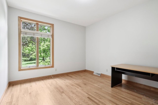 W313N4961 Chapel Ridge Rd, Hartland, WI 53029 - empty room with light wood-type flooring and baseboards