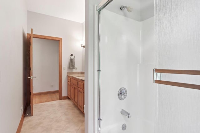W313N4961 Chapel Ridge Rd, Hartland, WI 53029 - bathroom with vanity, shower / washtub combination, and tile patterned floors