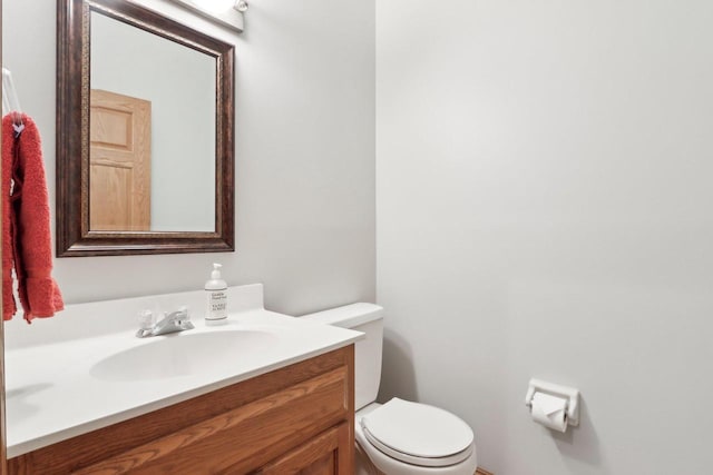 W313N4961 Chapel Ridge Rd, Hartland, WI 53029 - half bathroom featuring vanity and toilet