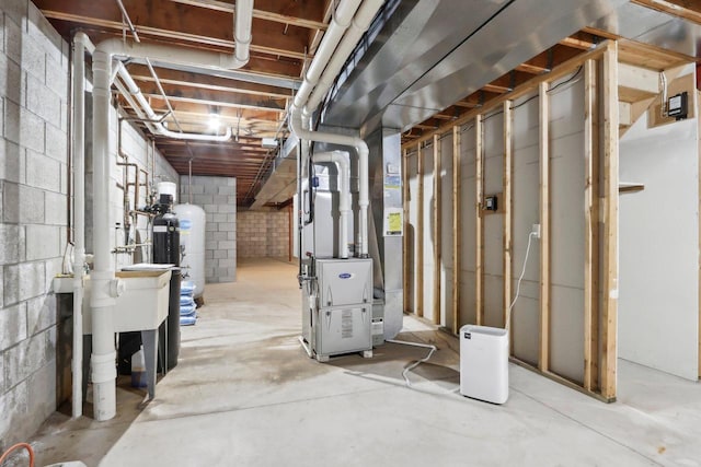 W313N4961 Chapel Ridge Rd, Hartland, WI 53029 - below grade area featuring heating unit and concrete block wall