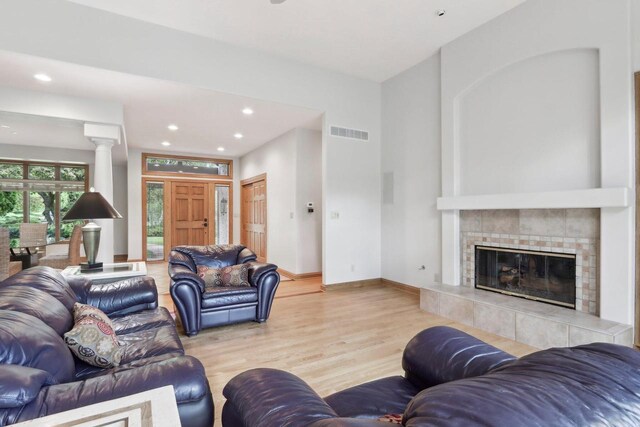 W313N4961 Chapel Ridge Rd, Hartland, WI 53029 - living room featuring wood finished floors, recessed lighting, a fireplace, and baseboards