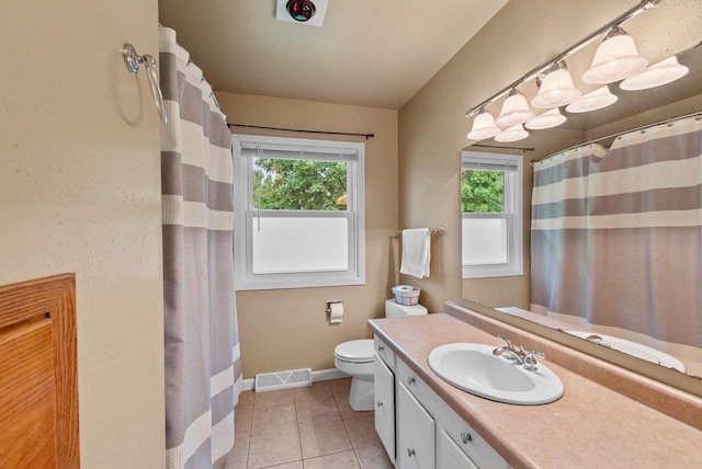116 Woodward St, Fond Du Lac, WI 54935 - full bath with healthy amount of natural light, vanity, tile patterned floors, and toilet