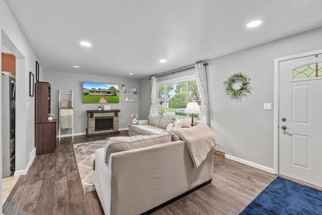 116 Woodward St, Fond Du Lac, WI 54935 - living area featuring a stone fireplace, baseboards, wood finished floors, and recessed lighting