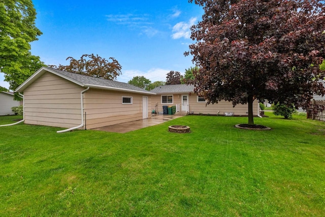 116 Woodward St, Fond Du Lac, WI 54935 - rear view of house featuring a yard, an outdoor fire pit, and a patio