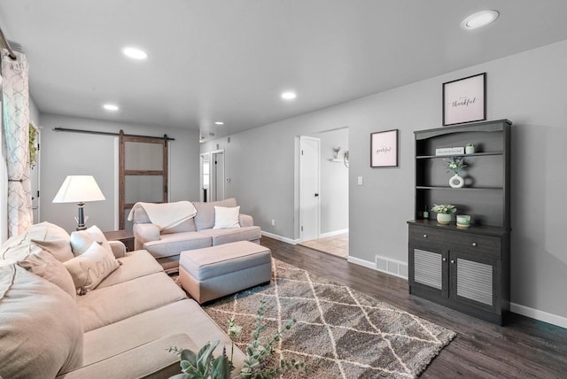 116 Woodward St, Fond Du Lac, WI 54935 - living area with a barn door, wood finished floors, baseboards, and recessed lighting
