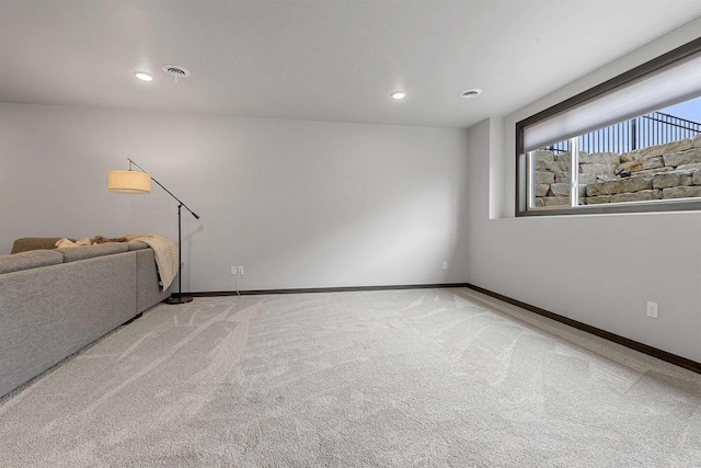 3812 Hawk Ledge Cir, De Pere, WI 54115 - unfurnished living room with light carpet, baseboards, and recessed lighting