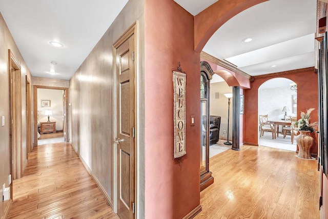 5125 Finger Rd, Green Bay, WI 54311 - corridor featuring arched walkways, light wood-style flooring, ornate columns, baseboards, and recessed lighting