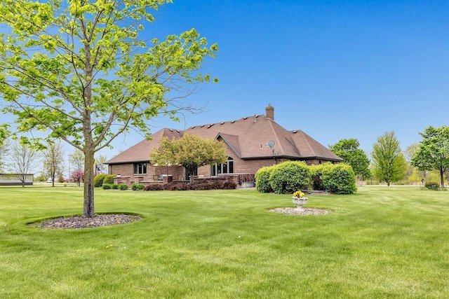 5125 Finger Rd, Green Bay, WI 54311 - view of front of property featuring a front yard and a chimney