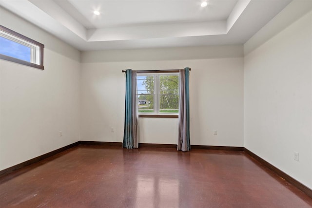 7947 Victoria Ct, Hewitt, WI 54441 - spare room featuring a raised ceiling, concrete floors, baseboards, and recessed lighting