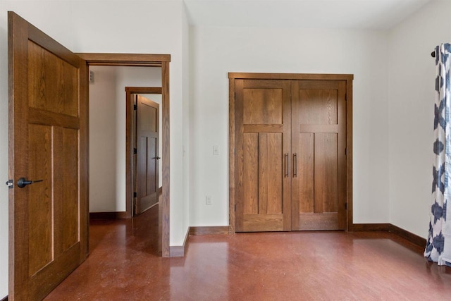 7947 Victoria Ct, Hewitt, WI 54441 - unfurnished bedroom featuring baseboards and concrete floors