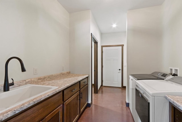 7947 Victoria Ct, Hewitt, WI 54441 - laundry area with separate washer and dryer and cabinet space