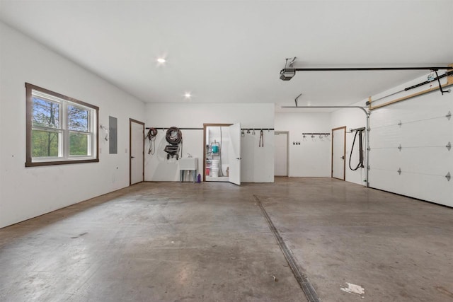 7947 Victoria Ct, Hewitt, WI 54441 - garage featuring a garage door opener, electric panel, and a sink