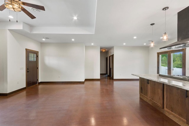 7947 Victoria Ct, Hewitt, WI 54441 - unfurnished living room featuring baseboards, concrete floors, recessed lighting, ceiling fan, and french doors
