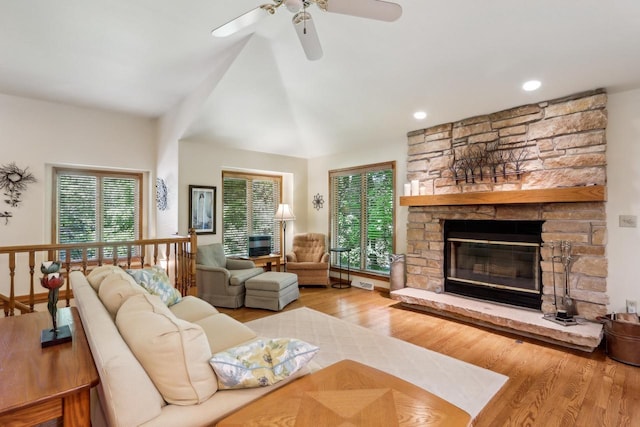 16625 Tanglewood Dr, Brookfield, WI 53005 - living room featuring ceiling fan, wood finished floors, a stone fireplace, lofted ceiling, and recessed lighting