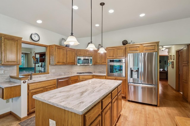16625 Tanglewood Dr, Brookfield, WI 53005 - kitchen featuring stainless steel appliances, brown cabinetry, backsplash, and recessed lighting