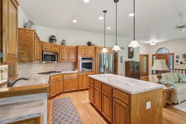 16625 Tanglewood Dr, Brookfield, WI 53005 - kitchen featuring stainless steel appliances, light wood finished floors, open floor plan, tasteful backsplash, and recessed lighting