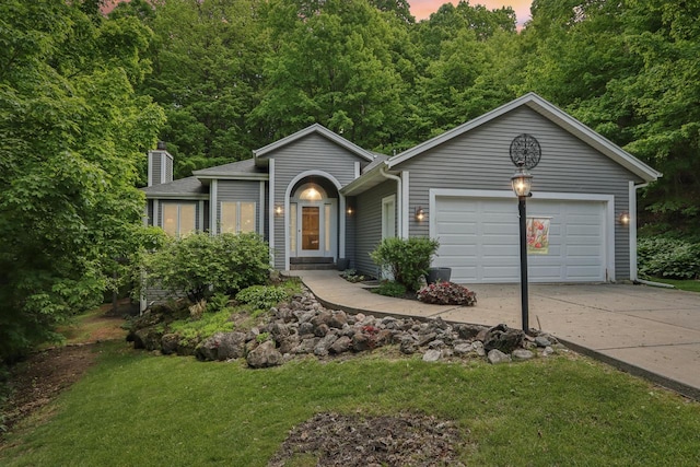 16625 Tanglewood Dr, Brookfield, WI 53005 - view of front facade with concrete driveway, a chimney, an attached garage, and a front yard