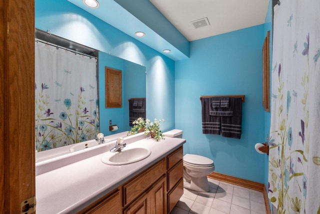 6241 N 118th St, Milwaukee, WI 53225 - full bath featuring vanity, toilet, tile patterned floors, baseboards, and recessed lighting
