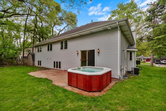 6241 N 118th St, Milwaukee, WI 53225 - back of house with a hot tub, a yard, a patio area, and central air condition unit