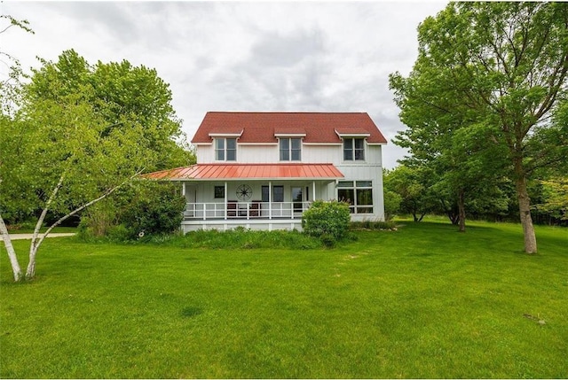 E2221 930th Ave, Boyceville, WI 54725 - back of house featuring a porch, a yard, a standing seam roof, and metal roof