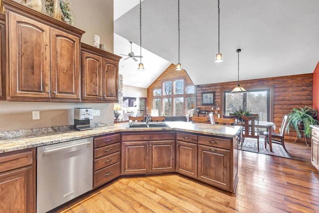 W12900 W Shore Dr, Crivitz, WI 54114 - kitchen featuring dishwasher, a sink, a peninsula, high vaulted ceiling, and light wood-style flooring