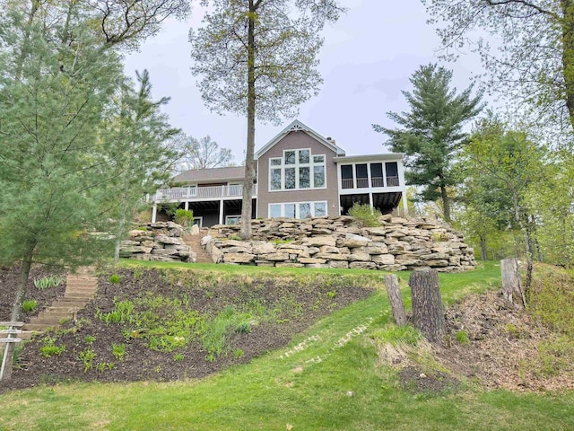 W12900 W Shore Dr, Crivitz, WI 54114 - rear view of house with stairs, a sunroom, and a wooden deck