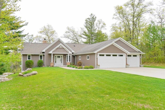 W12900 W Shore Dr, Crivitz, WI 54114 - view of front of property with driveway, a garage, a chimney, and a front yard