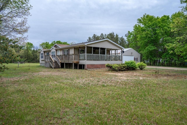 W5215 Aroma Ln, Necedah, WI 54646 - back of property with a yard, a garage, an outbuilding, and a deck