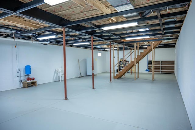 W5215 Aroma Ln, Necedah, WI 54646 - unfinished below grade area with stairs and a water pressure tank