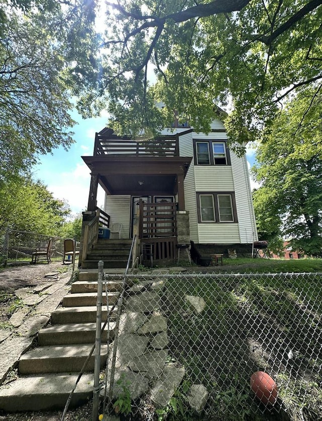 2931 W Chambers St Unit 2933, Milwaukee, WI 53210 - rear view of property with stairway and a porch