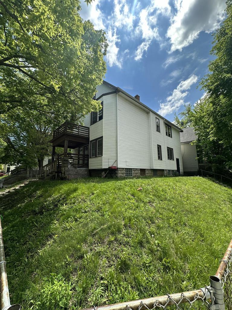 2931 W Chambers St Unit 2933, Milwaukee, WI 53210 - rear view of house featuring a yard