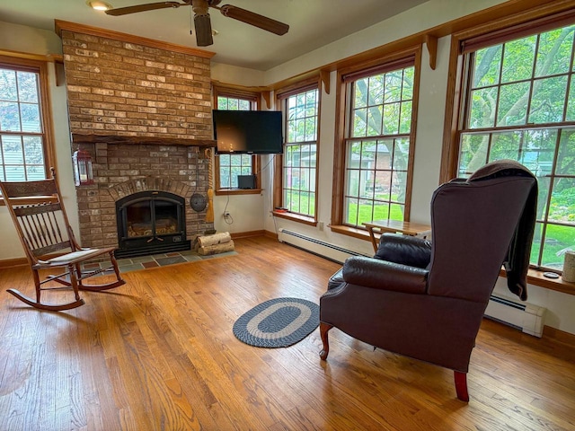 315 Lampert St, Oshkosh, WI 54901 - living area featuring baseboard heating and wood-type flooring