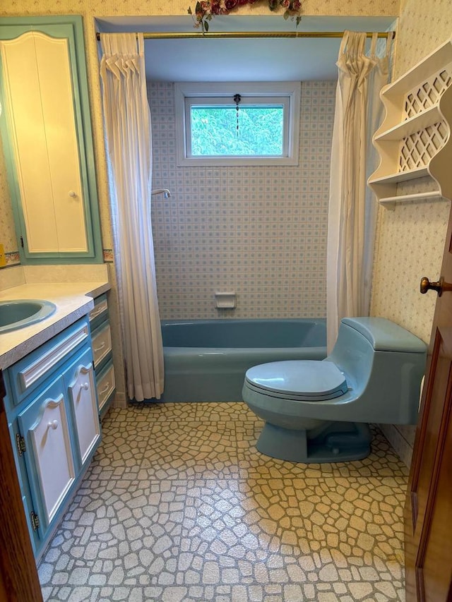 315 Lampert St, Oshkosh, WI 54901 - bathroom featuring toilet, shower / bath combo, and vanity