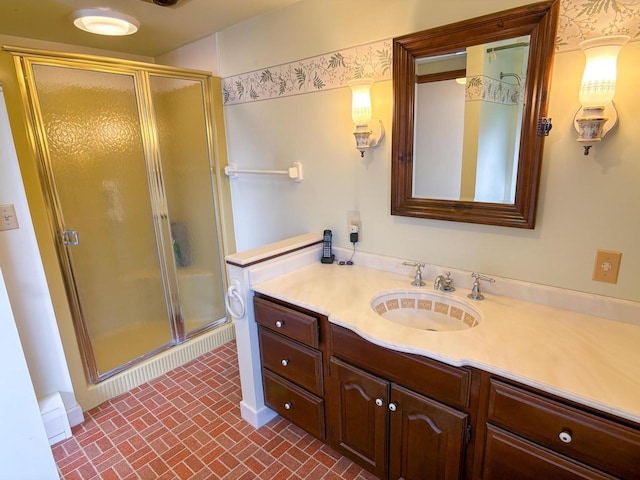 315 Lampert St, Oshkosh, WI 54901 - full bath with vanity, a stall shower, and brick patterned floors