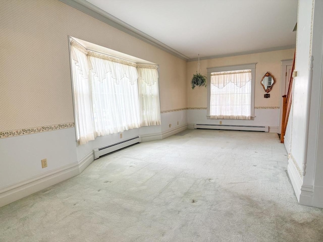315 Lampert St, Oshkosh, WI 54901 - empty room featuring baseboard heating, ornamental molding, and carpet flooring