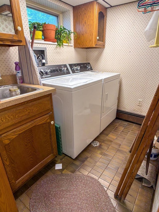 315 Lampert St, Oshkosh, WI 54901 - laundry area featuring washing machine and clothes dryer, wallpapered walls, cabinet space, tile patterned flooring, and baseboards