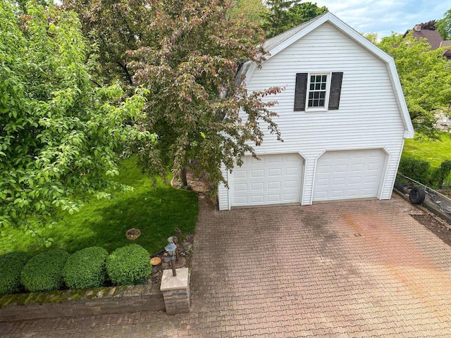 315 Lampert St, Oshkosh, WI 54901 - view of front of property with an attached garage and decorative driveway