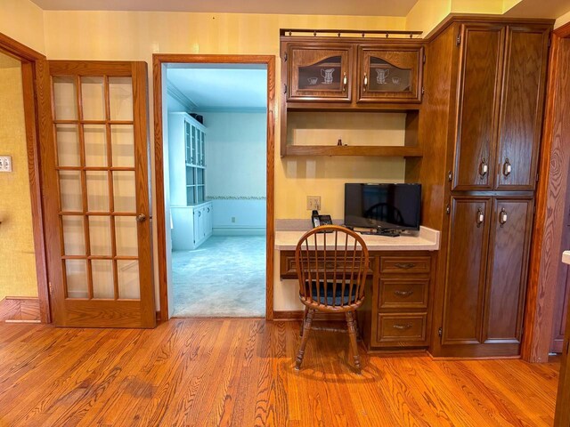 315 Lampert St, Oshkosh, WI 54901 - office featuring light wood-style floors, crown molding, and built in study area