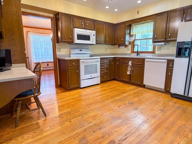 315 Lampert St, Oshkosh, WI 54901 - kitchen with white appliances, a sink, light countertops, and recessed lighting