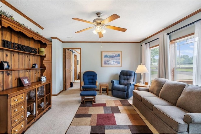 505 Lake Ave, Frederic, WI 54837 - living room with ornamental molding, light colored carpet, ceiling fan, and baseboards