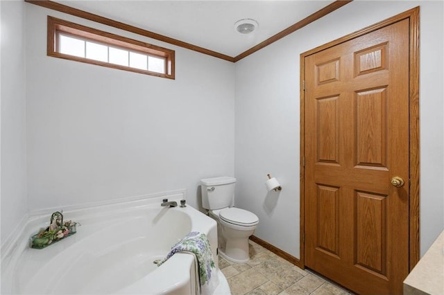 505 Lake Ave, Frederic, WI 54837 - bathroom with a bath, toilet, crown molding, and baseboards