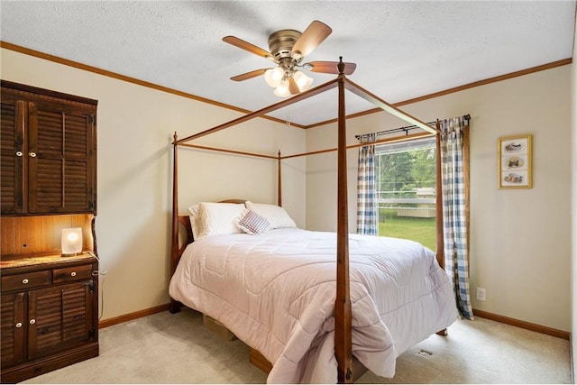 505 Lake Ave, Frederic, WI 54837 - bedroom with light colored carpet, baseboards, ornamental molding, and a ceiling fan