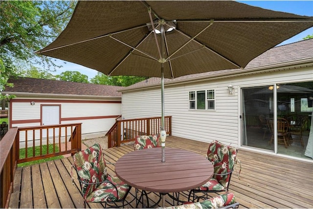 505 Lake Ave, Frederic, WI 54837 - wooden terrace featuring outdoor dining area