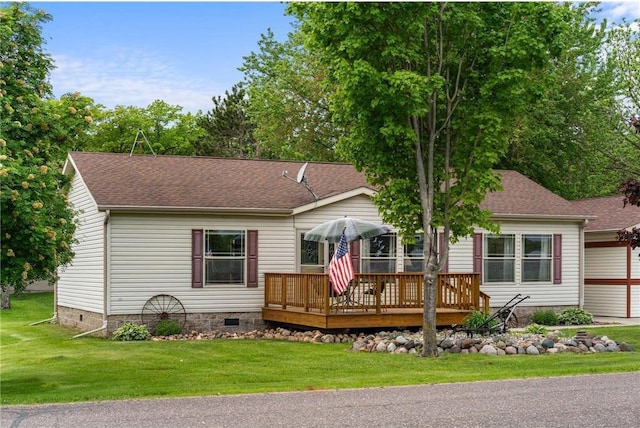 505 Lake Ave, Frederic, WI 54837 - view of front of property featuring a wooden deck, crawl space, a front yard, and a shingled roof