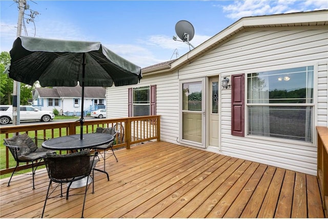 505 Lake Ave, Frederic, WI 54837 - wooden terrace featuring outdoor dining area