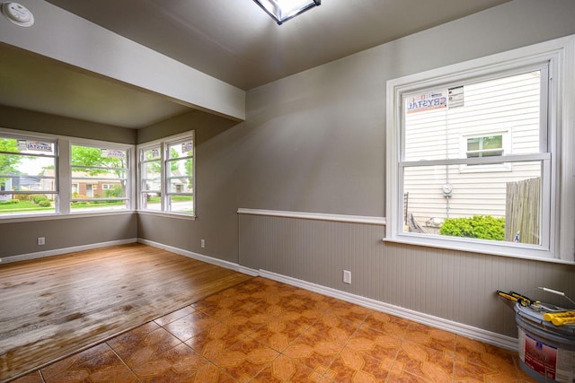 3776 S 16th St, Milwaukee, WI 53221 - spare room with baseboards and a wainscoted wall
