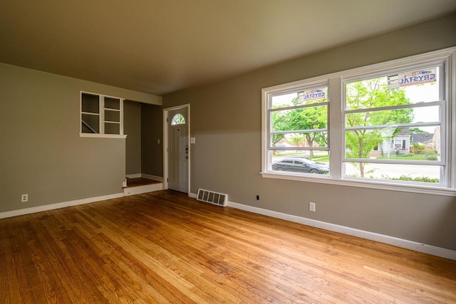 3776 S 16th St, Milwaukee, WI 53221 - spare room featuring plenty of natural light, wood finished floors, and baseboards